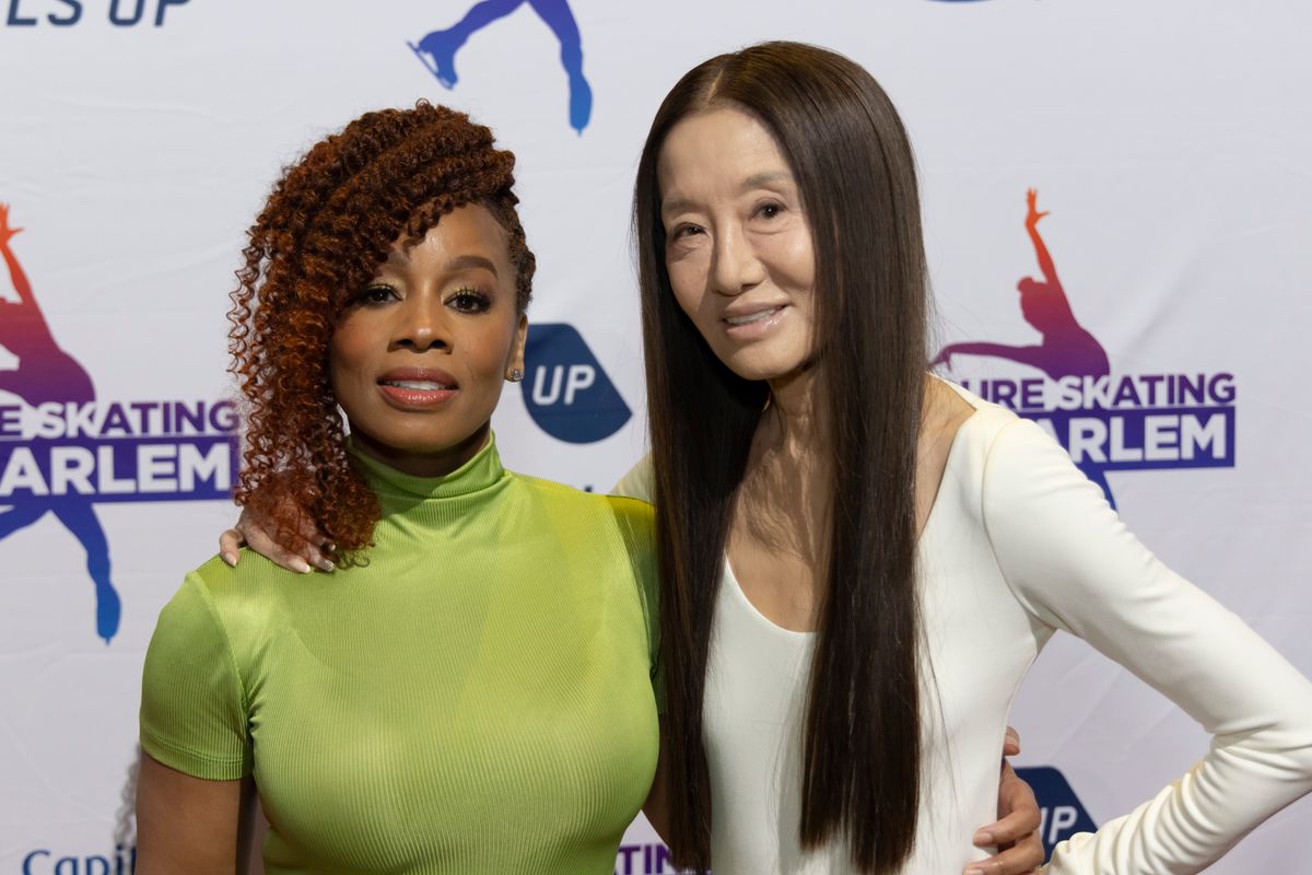 She removed them to pose with Anika Noni Rose