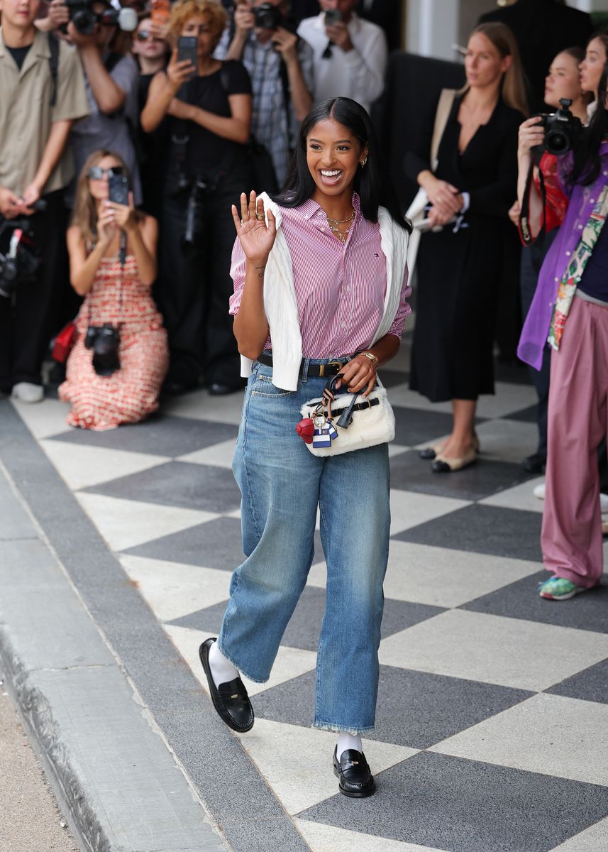A small fuzzy handbag and layered jewelry kept the outfit from feeling too literal or collegiate.