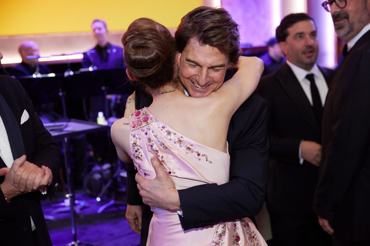Ariana Grande and Tom Cruise share a hug