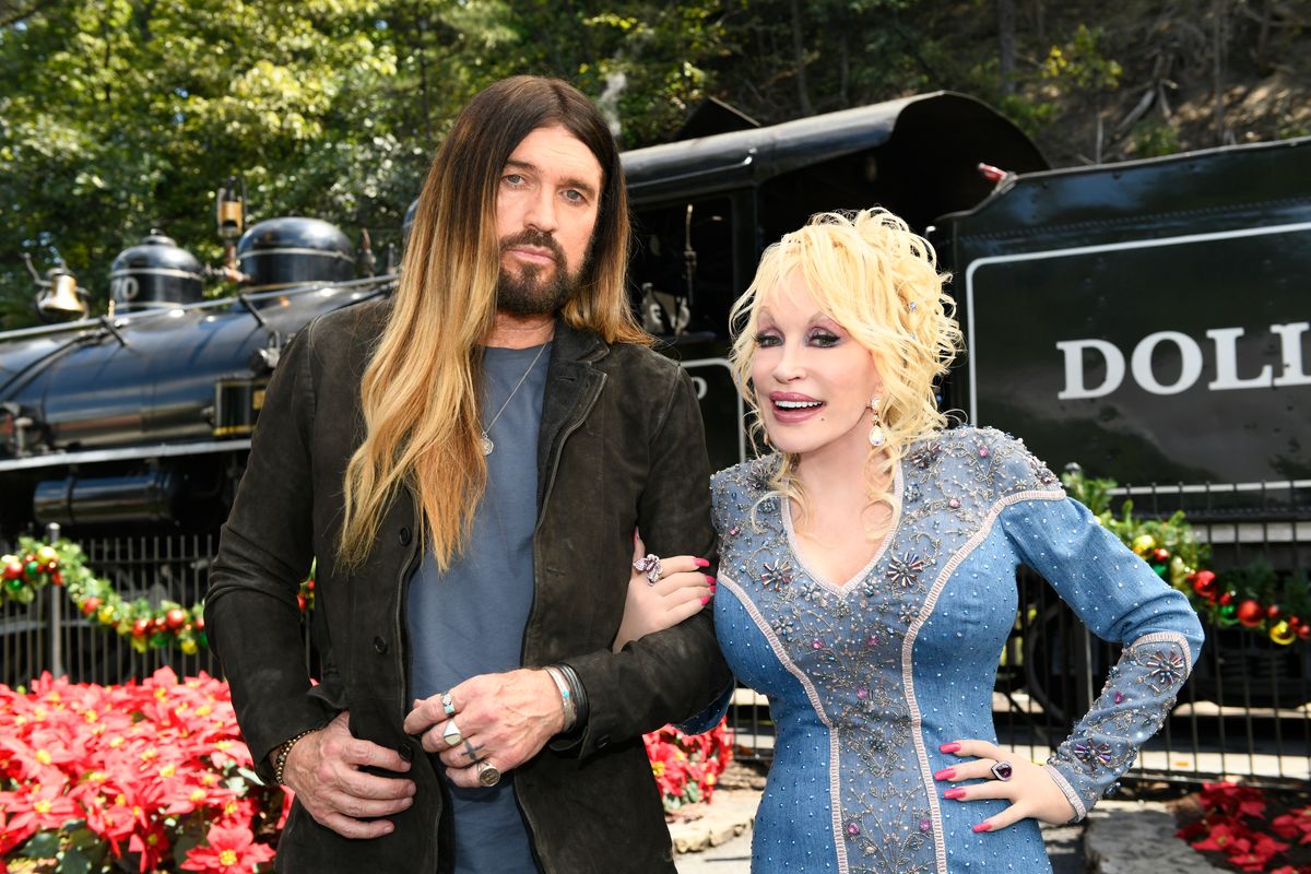 DOLLY PARTON'S MOUNTAIN MAGIC CHRISTMAS -- Pictured: (l-r) Billy Ray Cyrus as himself, Dolly Parton as herself -- (Photo by: Katherine Bomboy/NBC via Getty Images)