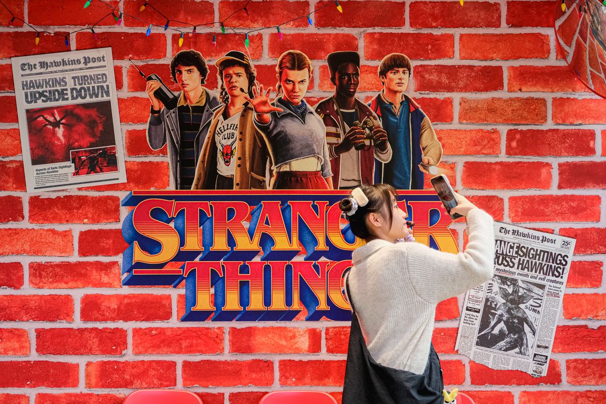 People take photos in front of the Stranger Things pop-up booth on December 25, 2025, in Hong Kong, China. 