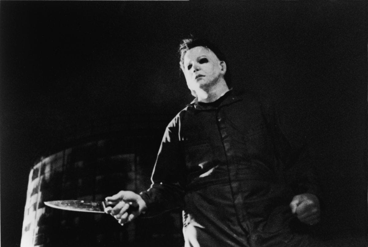 Actor Tony Moran, as masked killer Michael Myers, wields a knife in a still from the horror film, 'Halloween,' directed by John Carpenter, 1978.