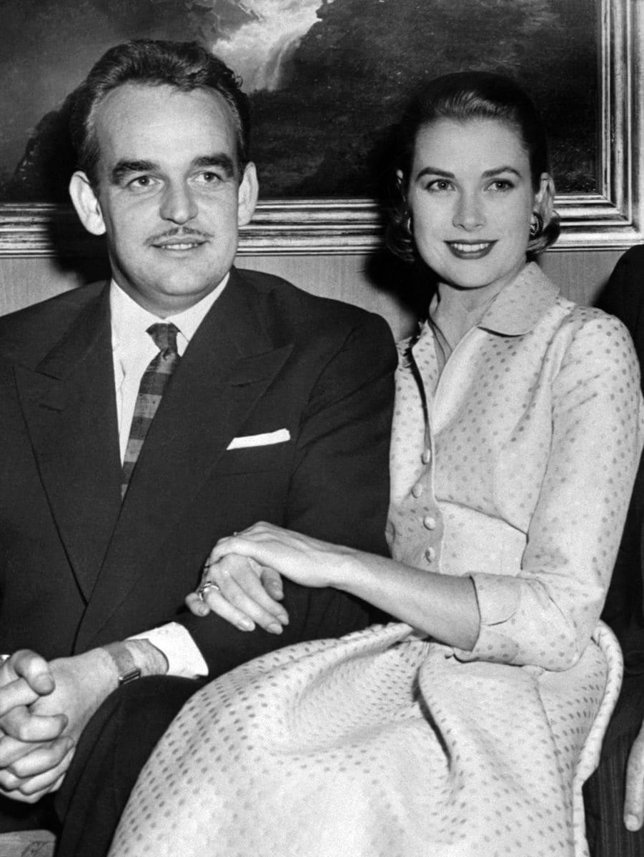 Prince Rainier III of Monaco and his fiancee Grace Kelly with her engagement ring pose on January 05, 1956.