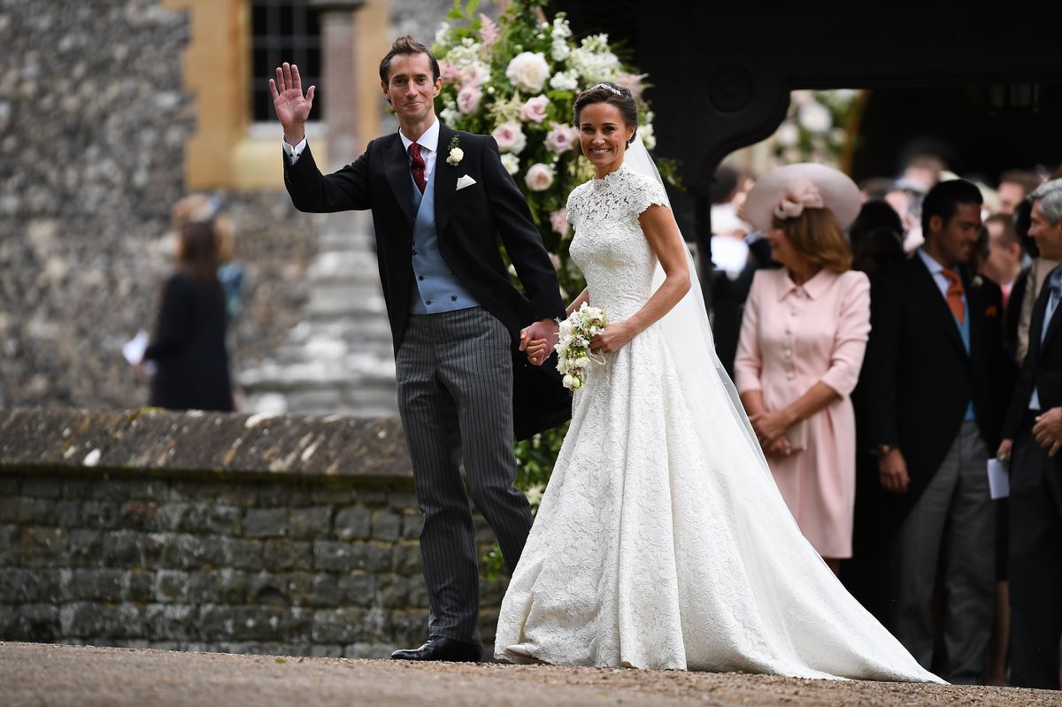 ENGLEFIELD GREEN, ENGLAND - MAY 20: Pippa Middleton and her new husband James Matthews leave church following their wedding ceremony at St Mark's Church as the bridesmaids and pageboys walk ahead on May 20, 2017 in Englefield Green, England.  (Photo by Justin Tallis - WPA Pool/Getty Images)