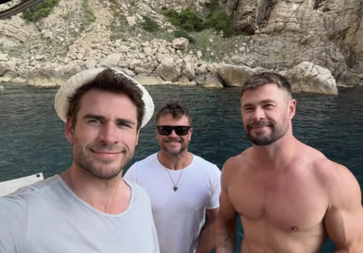 Liam, Luke and Chris Hemsworth enjoying themselves by the water