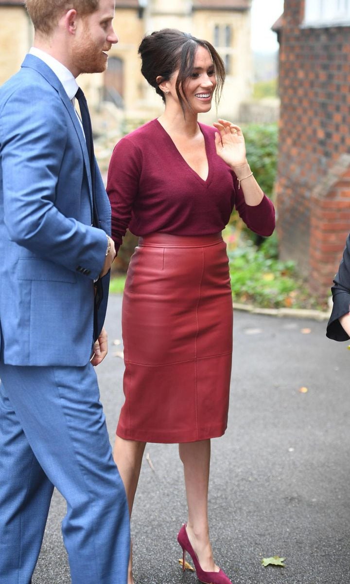 Meghan Markle wears a pencil leather skirt