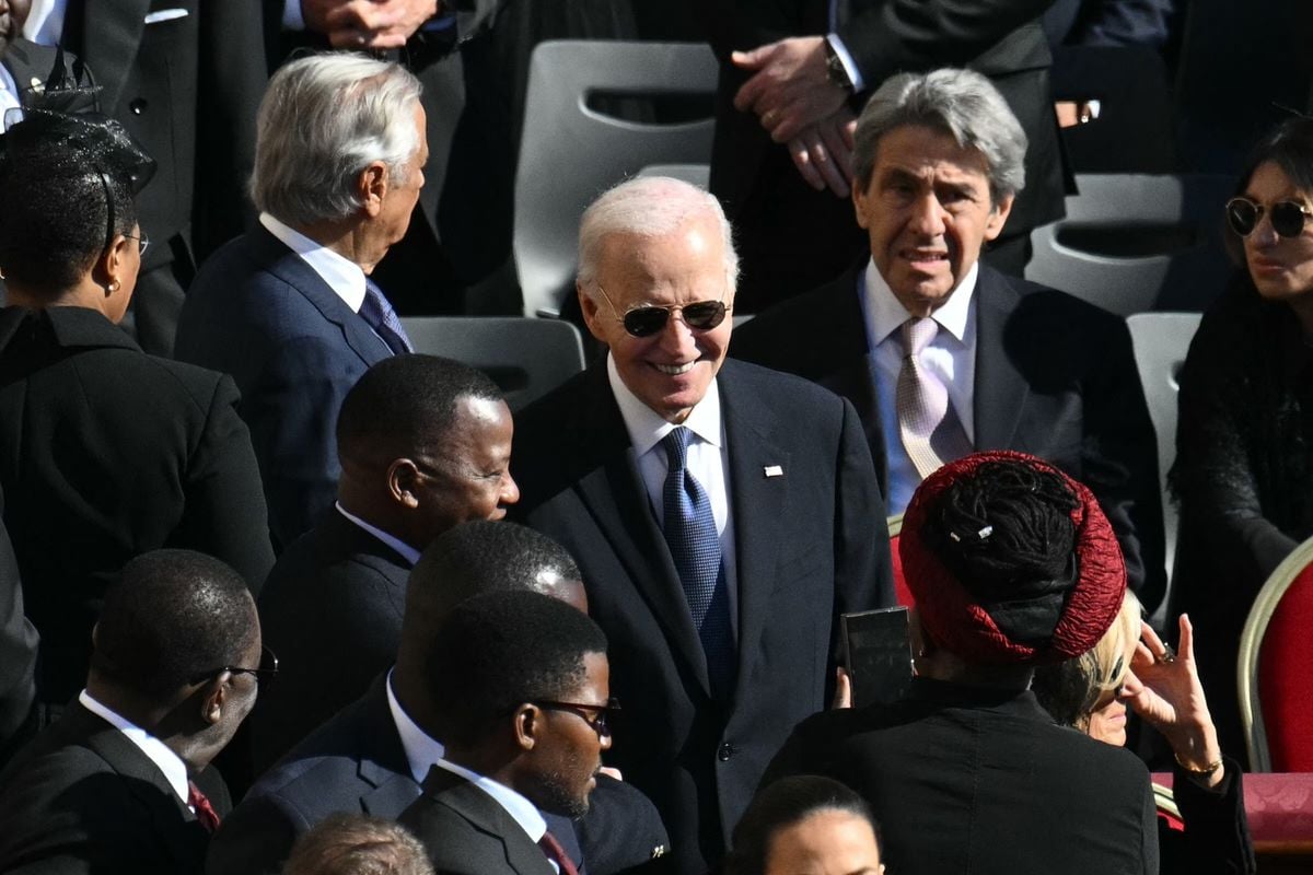 Former US President Joe Biden (C) speaks with attendees as he arrives ahead of the late Pope Francis' funeral ceremony at St. Peter's Square at the Vatican on April 26, 2025.