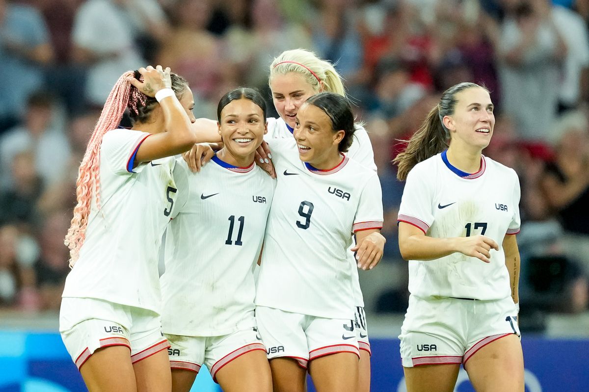 Smith celebrating her goal with her team