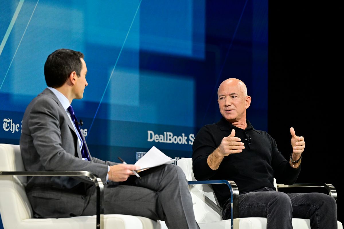 Andrew Ross Sorkin and Jeff Bezos speak onstage during The New York Times Dealbook Summit 2024 at Jazz at Lincoln Center .