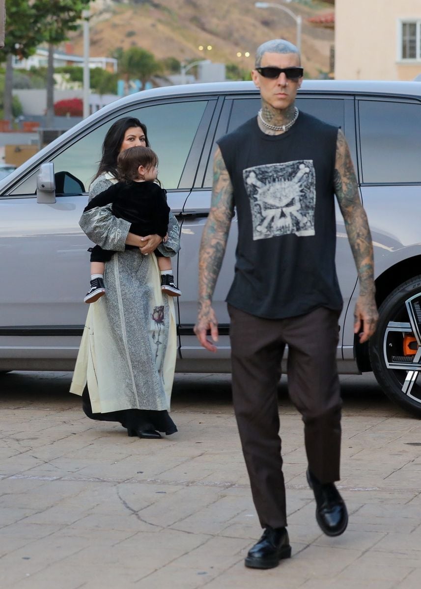 Kourtney Kardashian enjoys a family dinner at Nobu in Malibu, accompanied by her kids, Rocky Thirteen Barker, Penelope, and Reign, along with friends. Reign Disick took a page out of his father's fun antics by flipping the bird and making funny faces! **