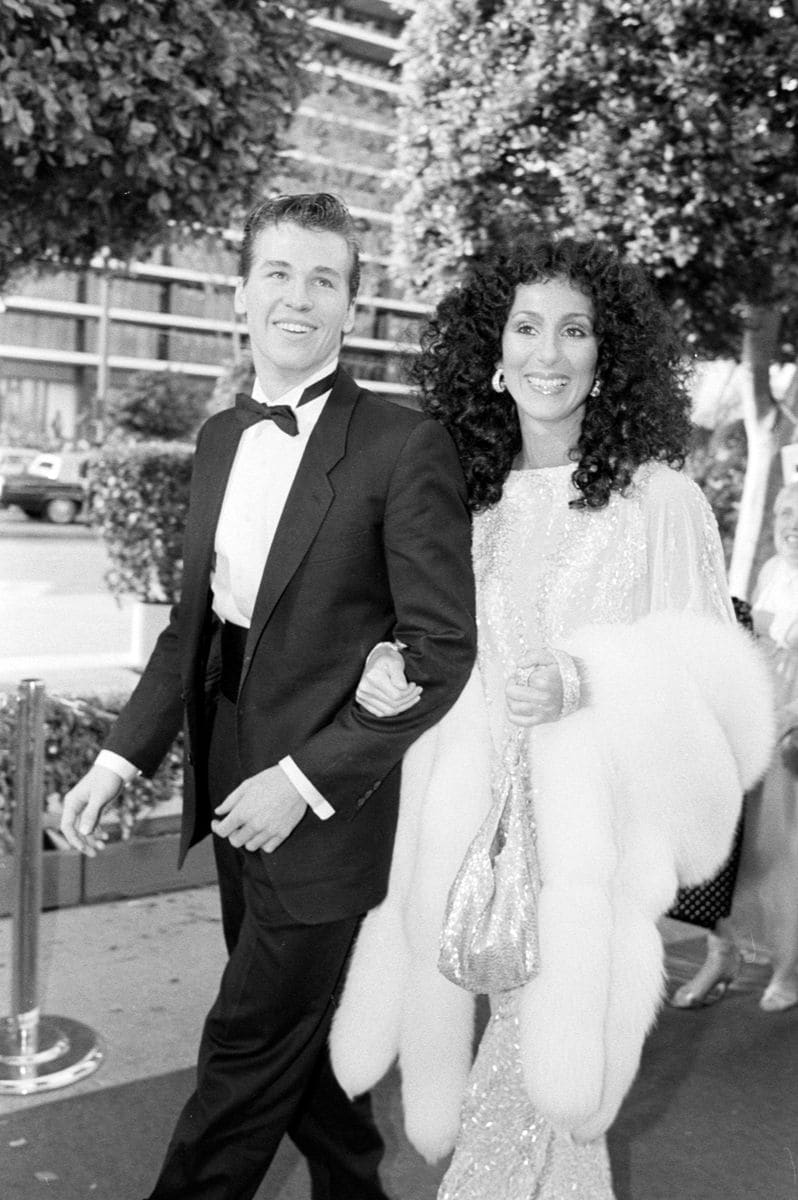 Val Kilmer and Cher attend the 55th Academy Awards at the Dorothy Chandler Pavillion in Los Angeles, California, on April 11, 1983.