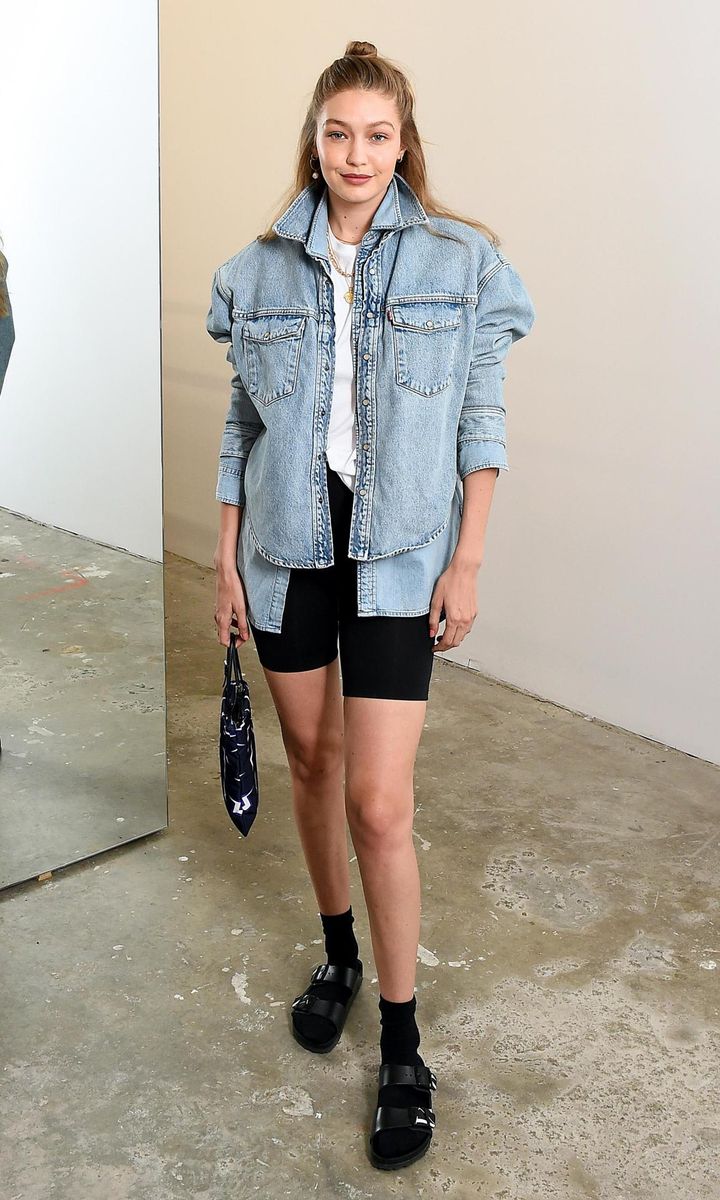Gigi Hadid with biker shorts and blue denim jacket
