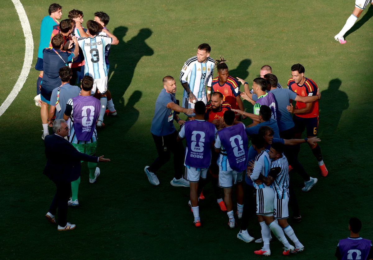 Security and team staff rushed in as tensions escalated on the pitch