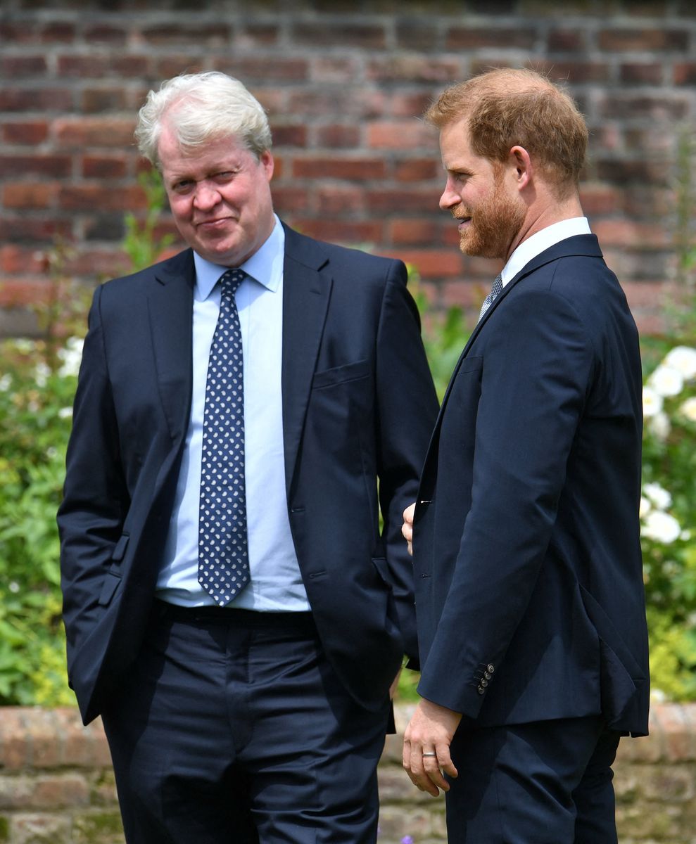 Britain's Prince Harry, Duke of Sussex (R) chats with his uncle Earl Spencer ahead of the unveiling of a statue of their mother, Princess Diana at The Sunken Garden in Kensington Palace, London on July 1, 2021, which would have been her 60th birthday. - Princes William and Harry set aside their differences on Thursday to unveil a new statue of their mother, Princess Diana, on what would have been her 60th birthday. (Photo by Dominic Lipinski / POOL / AFP) (Photo by DOMINIC LIPINSKI/POOL/AFP via Getty Images)