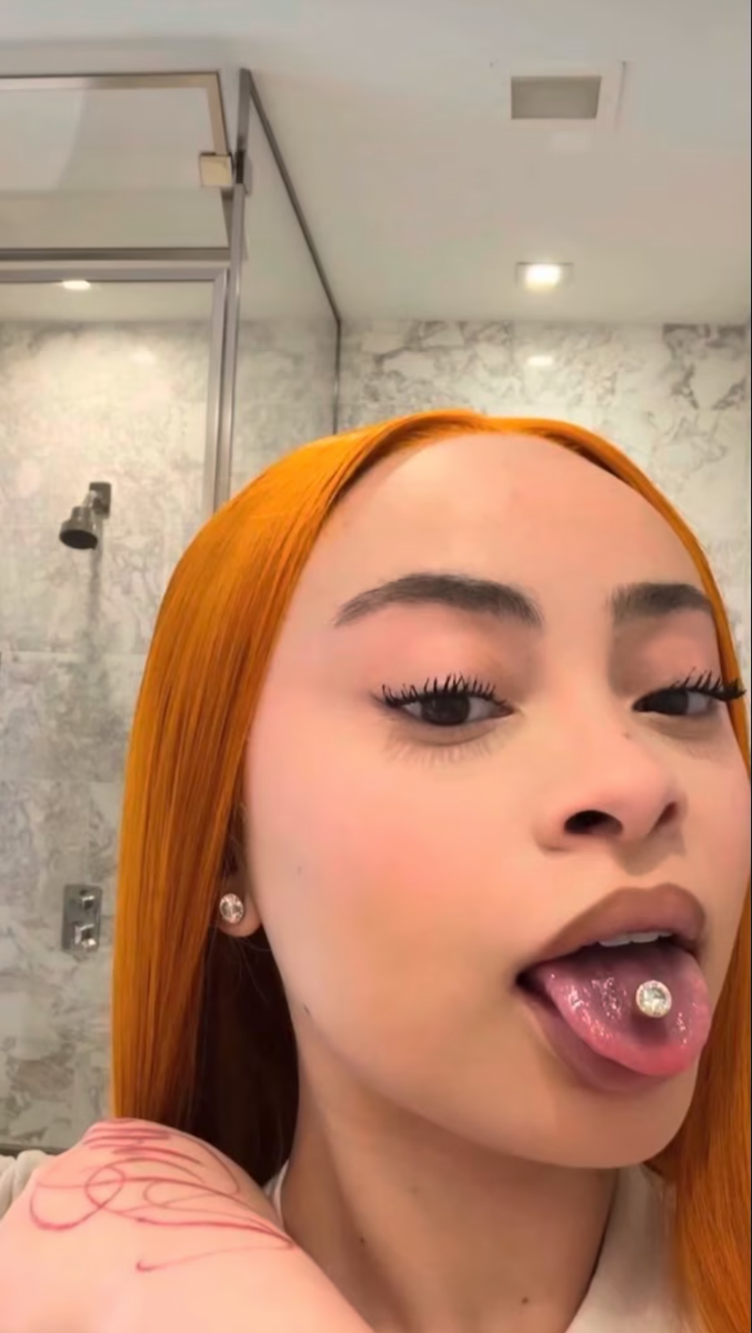 Ice Spice unveiled a custom $50,000 diamond tongue ring crafted by Benny The Jeweler. The rapper's latest luxury accessory comes after attending Taylor Swift and Travis Kelce's wedding.
