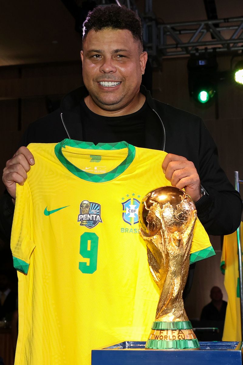 Brazilian former football player Ronaldo Nazario poses for photographers during a ceremony organized by Brazilian Football Confederation to honor 2002 FIFA World Champions