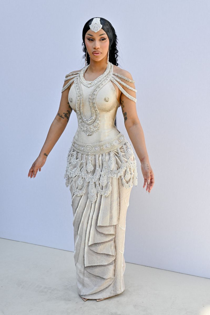 
Cardi B turned heads in a cream embroidered dress paired with strappy heels, delivering an elegant yet eye-catching look that reflected her signature glamorous style.