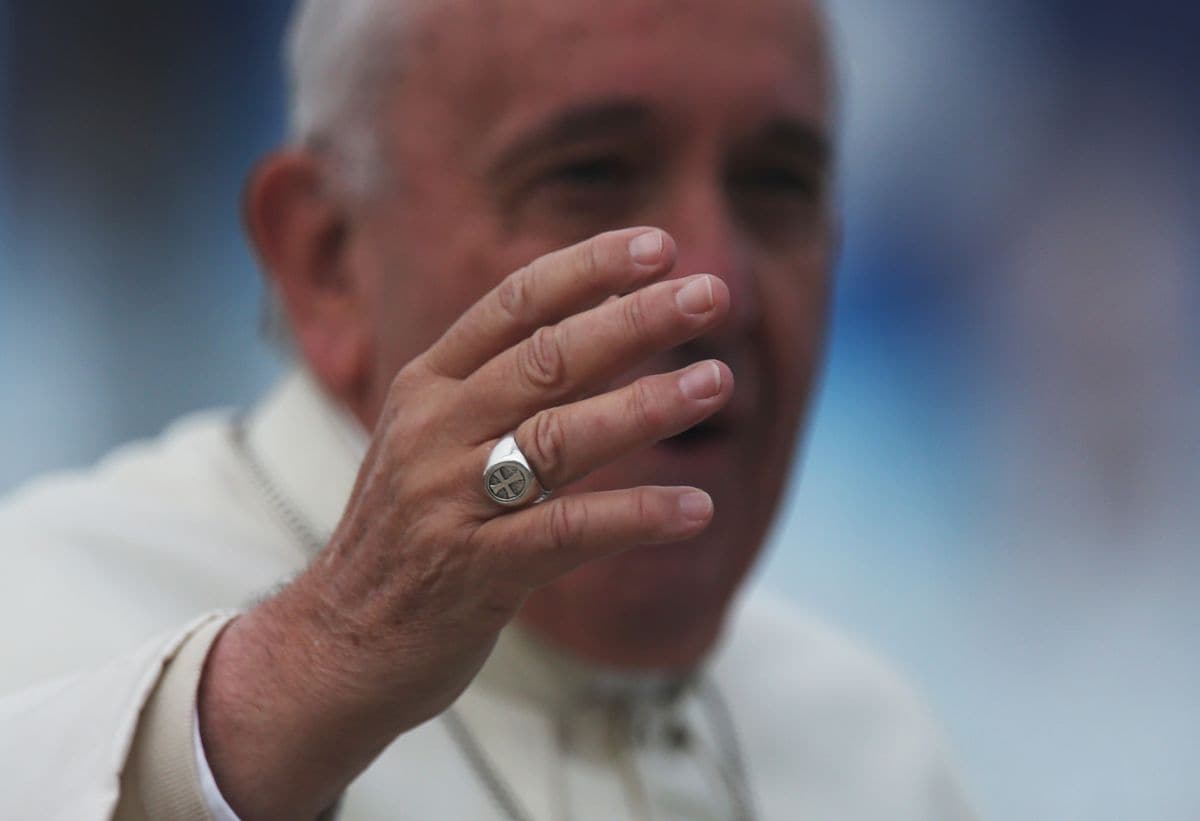 Pope Francis' ring is seen as he waves to the crowd from the Popemobile in Santa Cruz, Bolivia