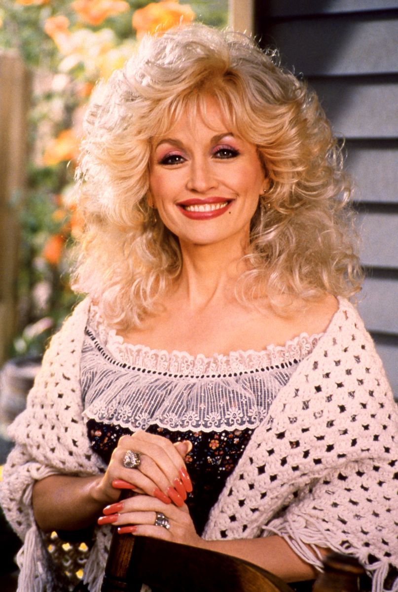 American singer-songwriter, actress, and businesswoman Dolly Parton, poses for a portrait circa 1995 at Dollywood in Pigeon Forge, Tennessee. (Photo by Ron Davis/Getty Images)