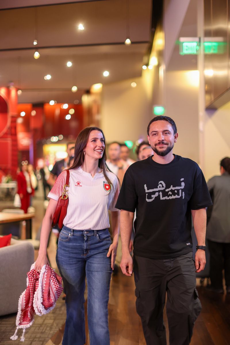 Crown Prince Hussein and Crown Princess Rajwa arrive at the stadium to cheer on Jordan during its first-ever World Cup finals appearance.