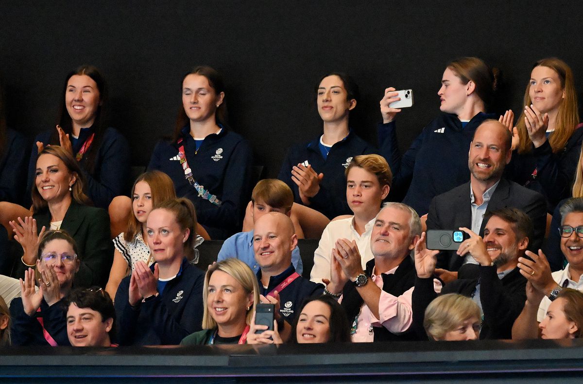 Prince William chats with George, Charlotte and Louis as the family watches the netball semifinals.