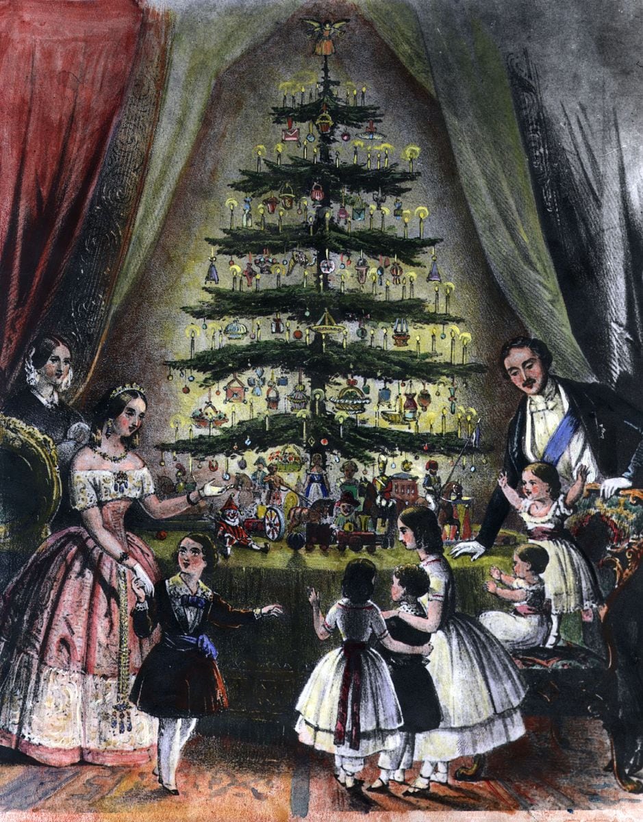 December 1848:  The Royal Christmas tree is admired by Queen Victoria, Prince Albert and their children.  (Photo by Hulton Archive/Getty Images)