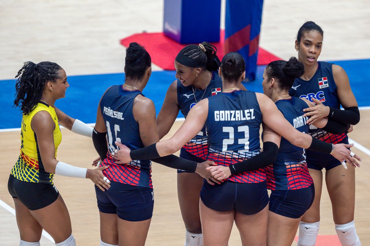 Players of team Dominican Republic celebrate after winning a point during the women's Volleyball Nations League match