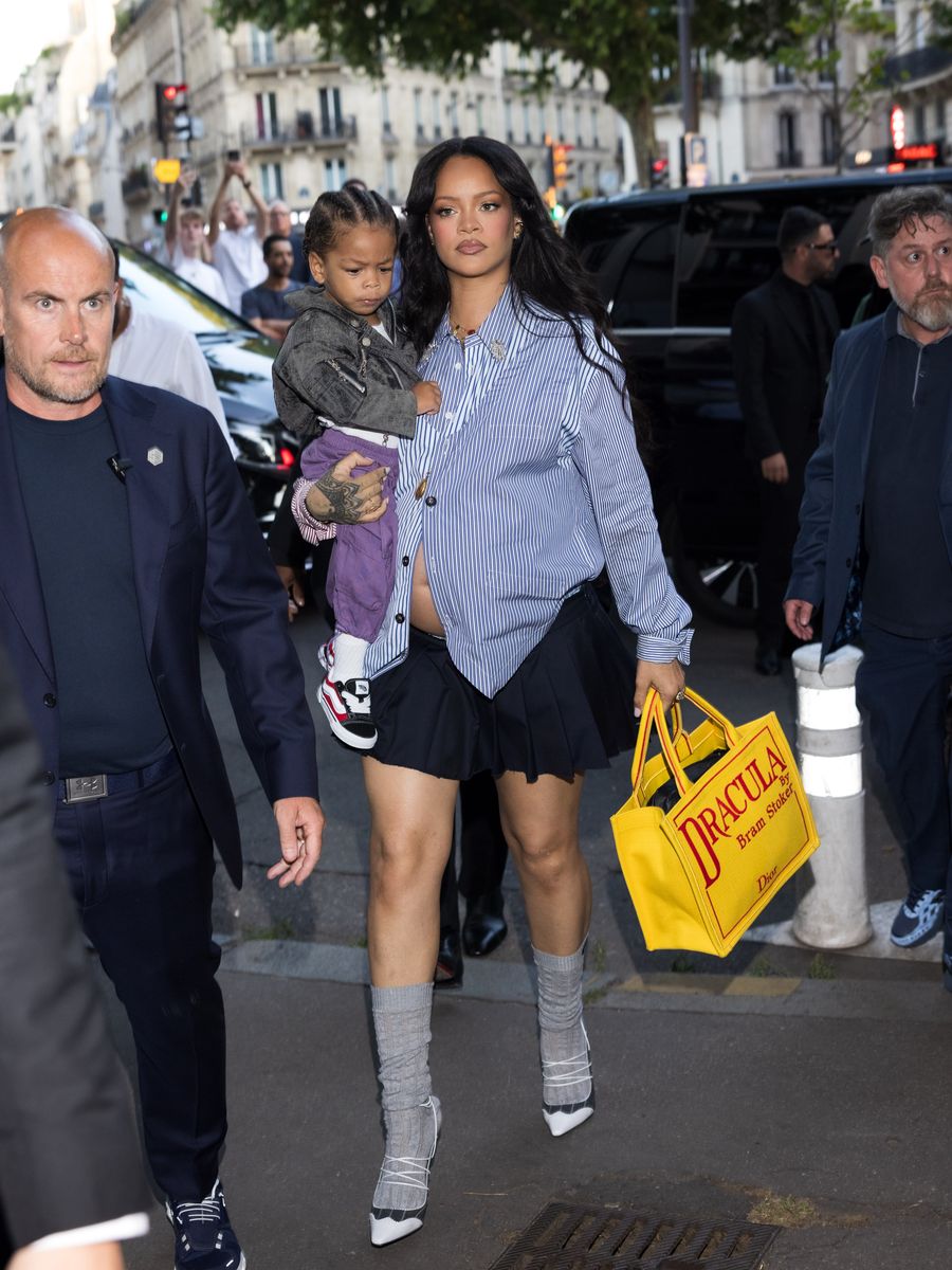 Rihanna wore a black mini skirt and blue shirt to attend the AWGE Menswear Spring/Summer 2026 show as part of Paris Fashion Week 