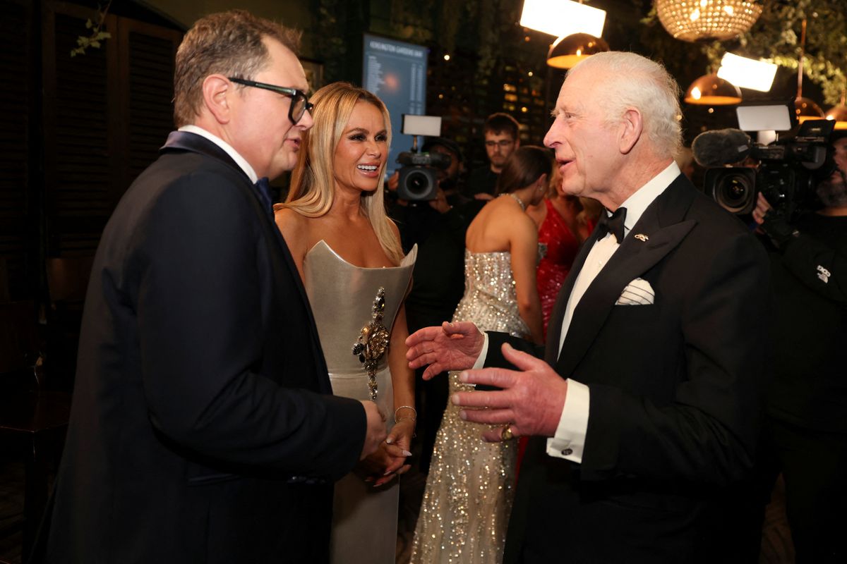 LONDON, ENGLAND - NOVEMBER 22: King Charles III meets Alan Carr and Amanda Holden after the Royal Variety Performance at the Royal Albert Hall on November 22, 2024. (Photo by Hollie Adams - Pool/Getty Images)