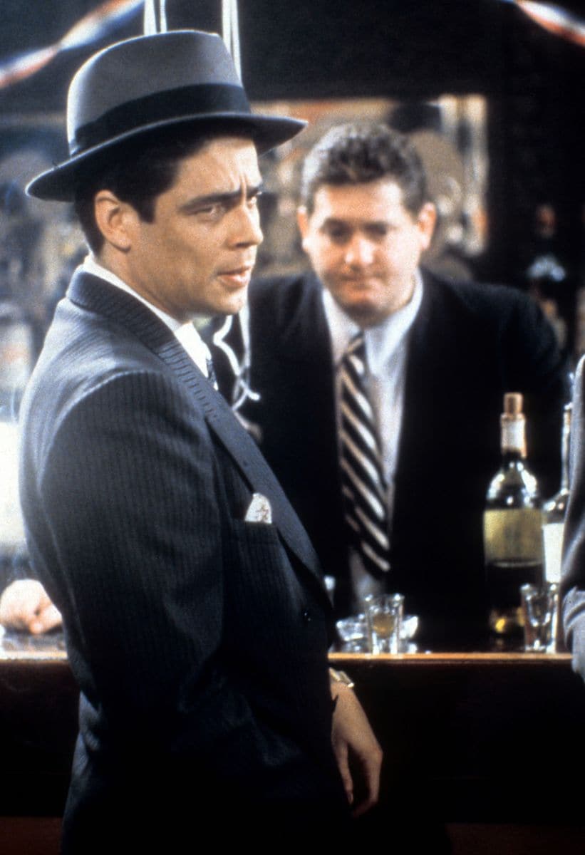 Benicio Del Toro across bar from Chris Penn in a scene from the film 'The Funeral', 1996.