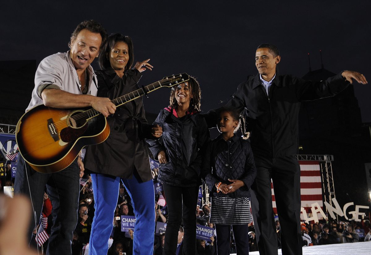 Barack Obama, his wife Michelle, and daughters Sasha and Malia, introduced by Bruce Springsteen in 2008