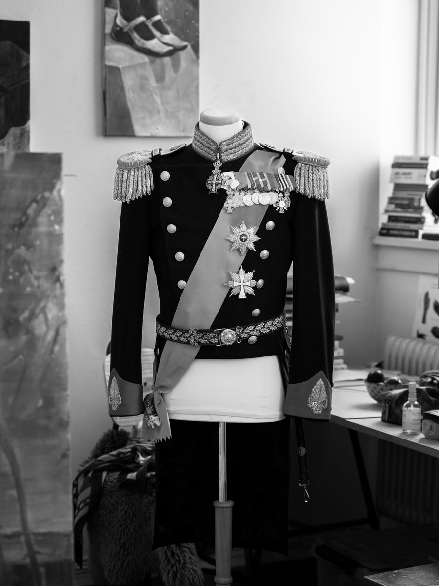 King Frederik’s ceremonial uniform is displayed inside the artist’s studio as part of the portrait process.