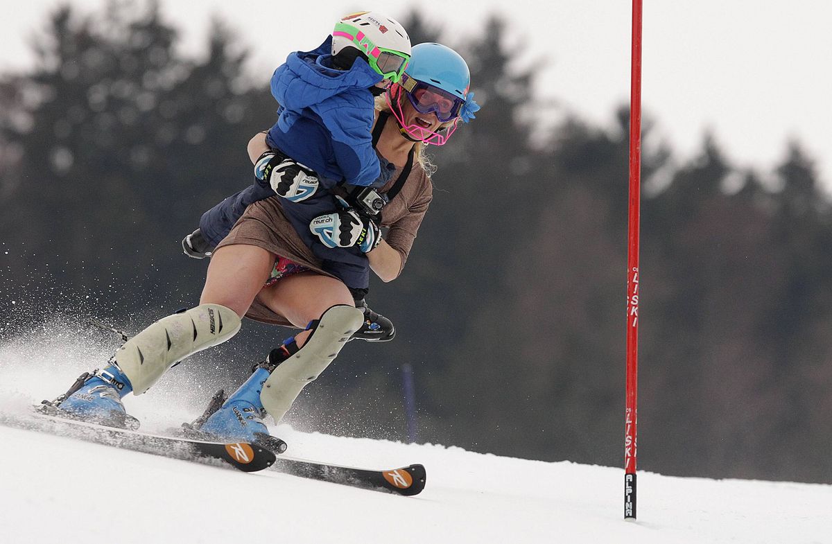 Sarah with Lasse skiing down the course ahead of her retirement at the World Cup in Lienz, Austria 