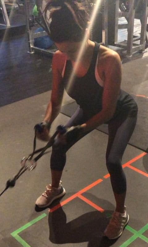 Eva Longoria performing traction exercises
