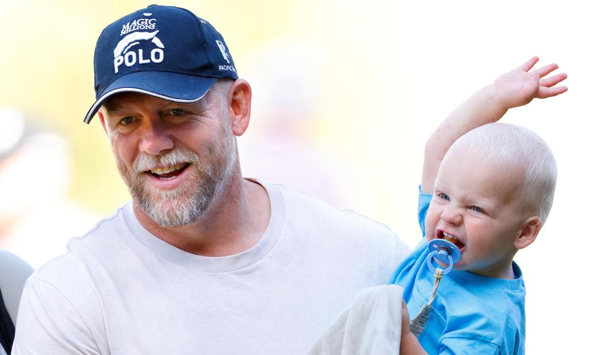 Lucas appeared happy as doting dad Mike carried him at the Festival of British Eventing.