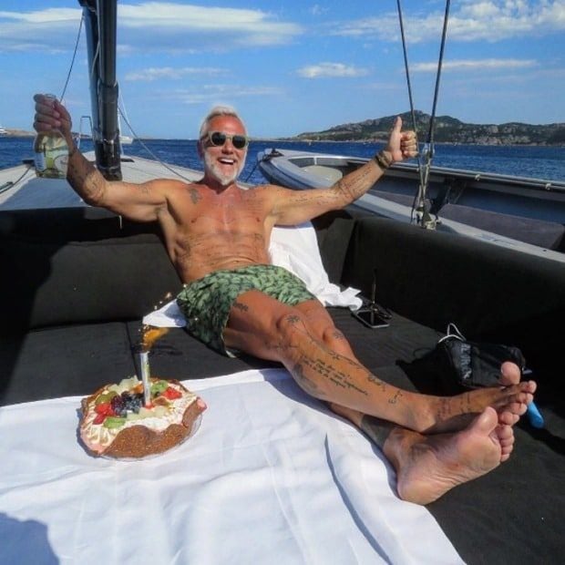 The millionaire enjoying his birthday cake on his yacht.
<br>
Photo: Instagram/@gianlucavacchi