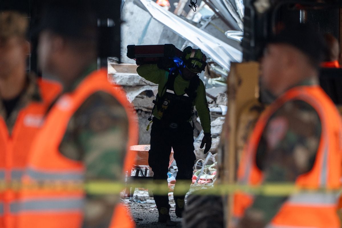 Rescue teams work at the Jet Set nightclub a day after the collapse of its roof in Santo Domingo on April 9, 2025. 