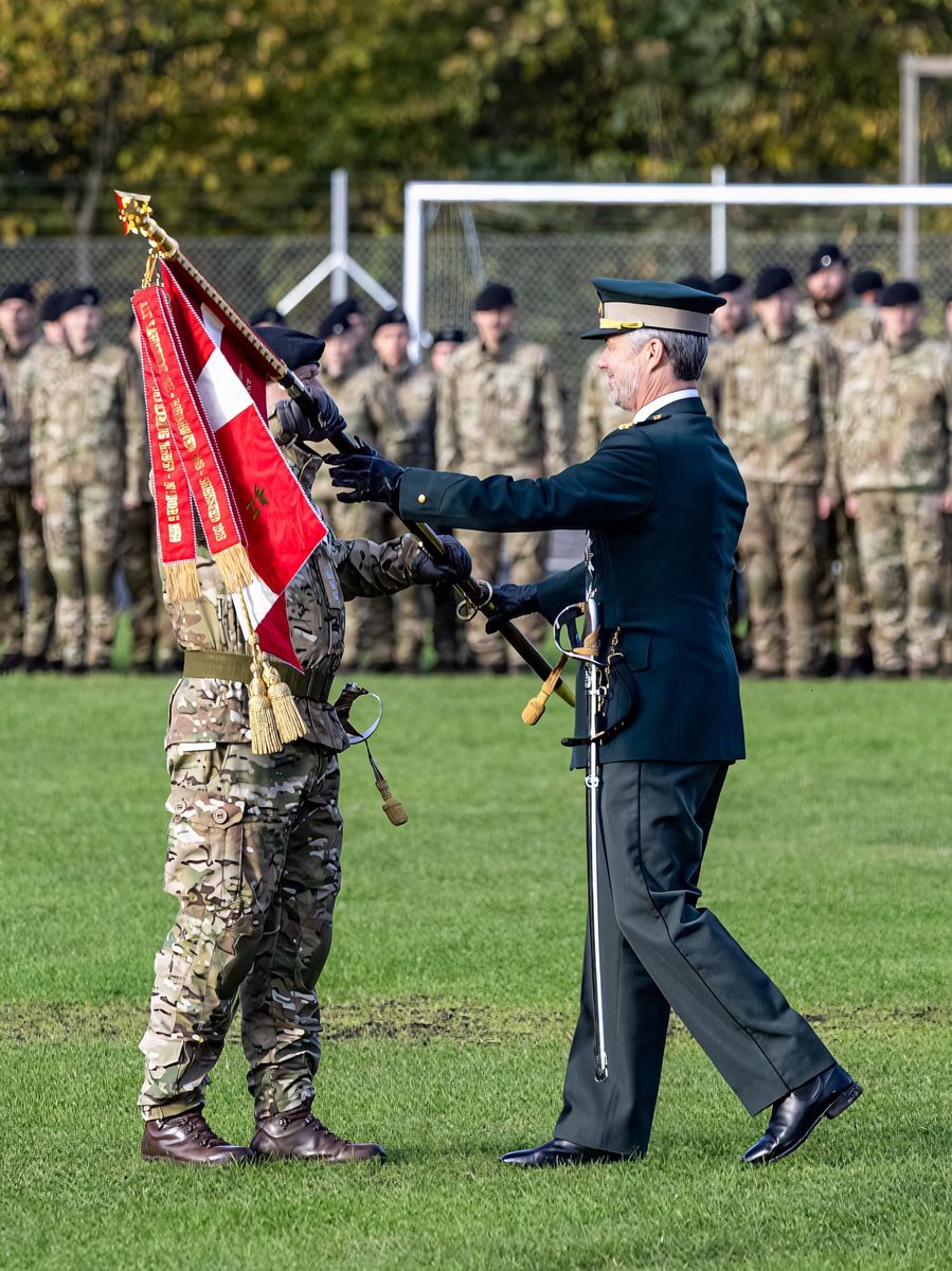 The Danish monarch appeared in full military uniform as he honored one of the country's oldest regiments, whose history dates back to 1679.