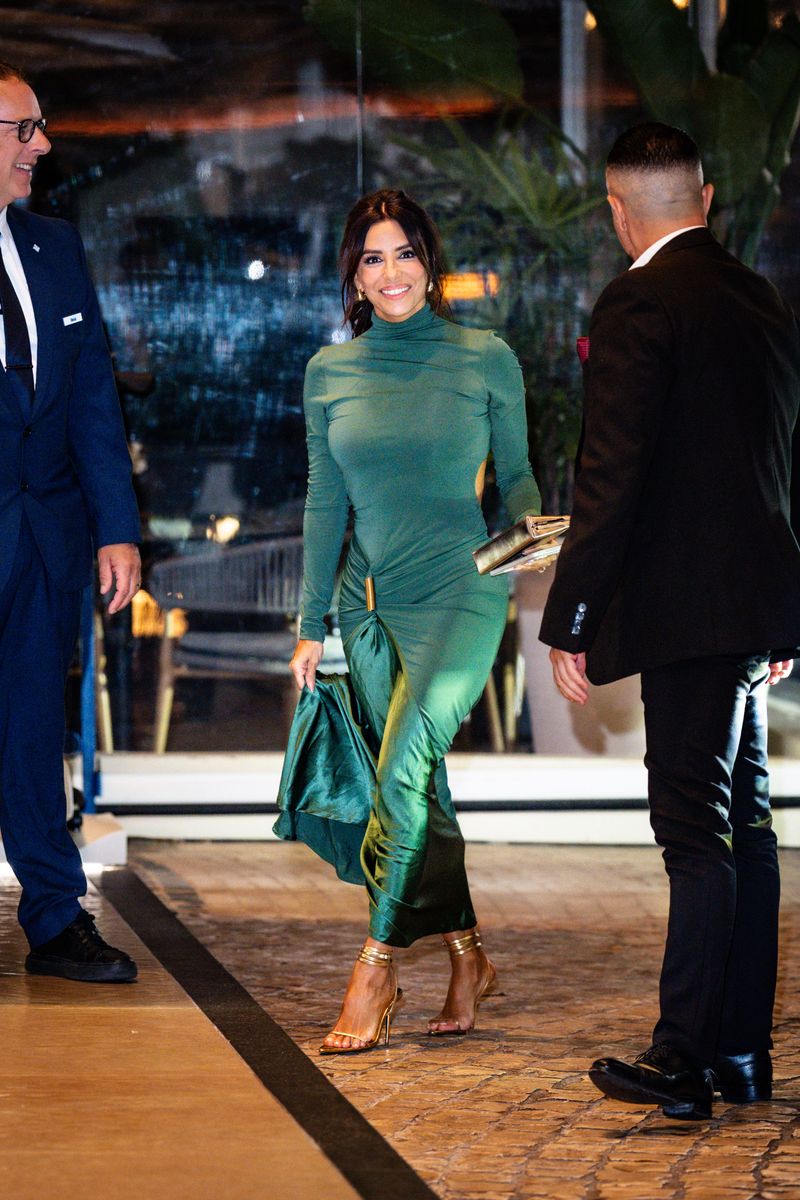 Longoria also embraced vibrant color in a fitted Silvia Tcherassi emerald green gown that featured a high neckline, gathered fabric details, and subtle side cutouts accented with gold hardware.