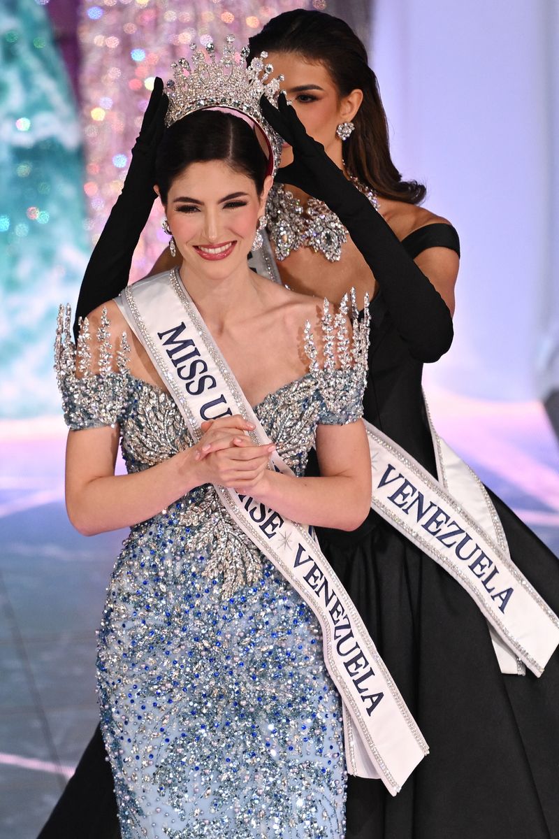 Miss Universe Venezuela 2024 Stephany Abasali (L) of Anzoategui State is crowned by outgoing Miss Venezuela 2023, Ileana Marquez, during the Miss Venezuela beauty pageant in Caracas.