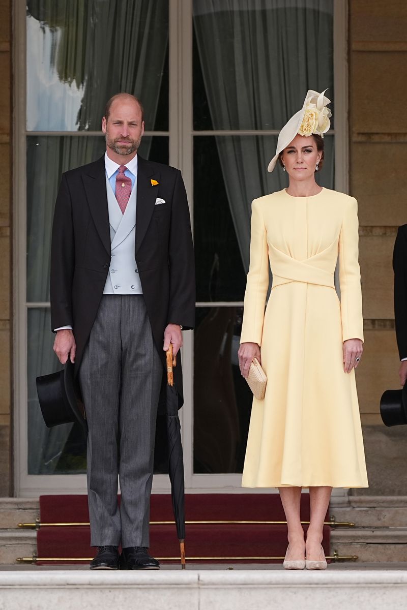 LONDON, ENGLAND - MAY 20: Prince William, Prince of Wales and Catherine, Princess of Wales stand at the top of the Garden steps before the start of a Royal Garden Party at Buckingham Palace on May 20, 2025 in London, England. (Photo by Aaron Chown - WPA Pool / Getty Images)