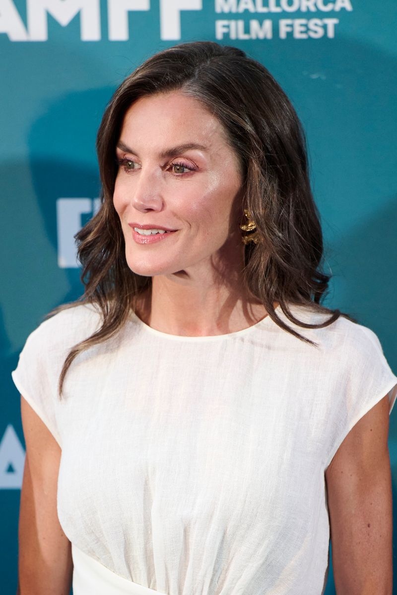 Queen Letizia stuns in a white corset dress and bold gold bracelet at Mallorca’s film fest