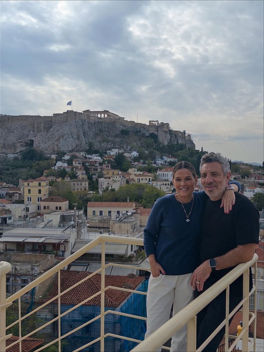 Chefs Cat Cora and John DeLucie take in the sweeping view of the Acropolis from Electra Roof Garden, the first stop of the trip