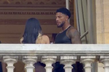 Romance rumors gained momentum because this balcony sighting followed another public appearance earlier in the day, where Okoye and Cardi B sat together front row during the Jean Paul Gaultier Haute Couture presentation