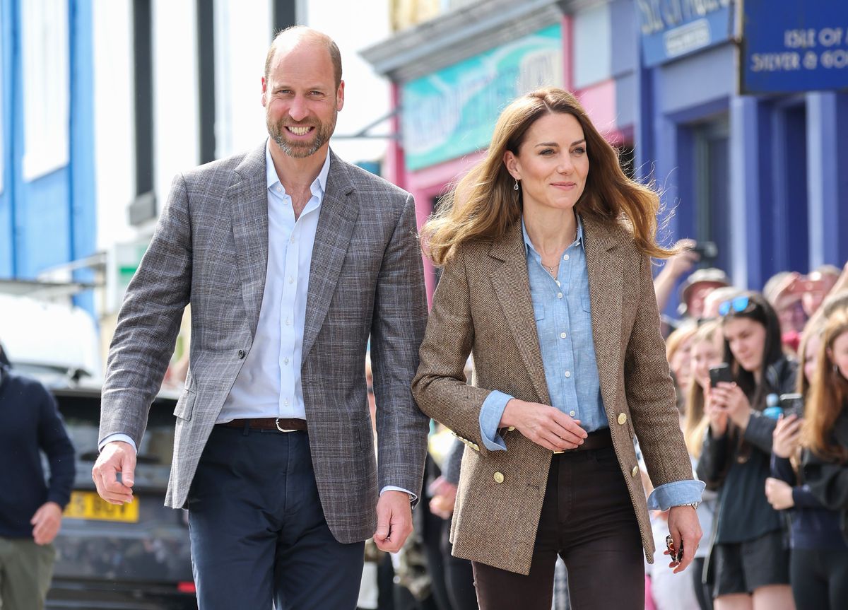 TOBERMORY, SCOTLAND - APRIL 29: Prince William, Prince of Wales, known as the Duke of Rothesay and Catherine, Princess of Wales, known as the Duchess of Rothesay when in Scotland, smile to well-wishers as they arrive for a visit to Aros Hall, a local community hub on April 29, 2025 in Tobermory, Scotland. The Prince and Princess of Wales are on a two-day visit to the Isles of Mull and Iona on the 29th and 30th of April to engage with rural island communities. During their time on the islands, they will connect with local residents, highlighting the value of social bonds and underscoring the importance of safeguarding and advocating for the natural environment. (Photo by Chris Jackson/Getty Images)