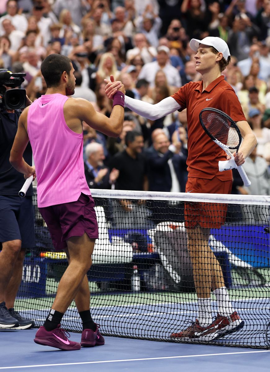Carlos Alcaraz of Spain shakes hands with Jannik Sinner after his four-set victory in the 2025 US Open men’s singles final in New York

