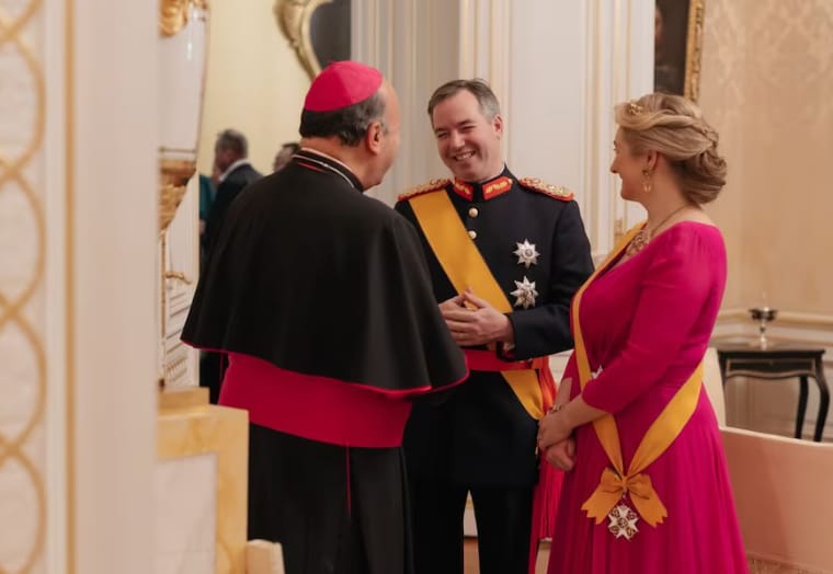 Both Guillaume and Stéphanie wore the orange sash of the Order of the Lion of the House of Nassau