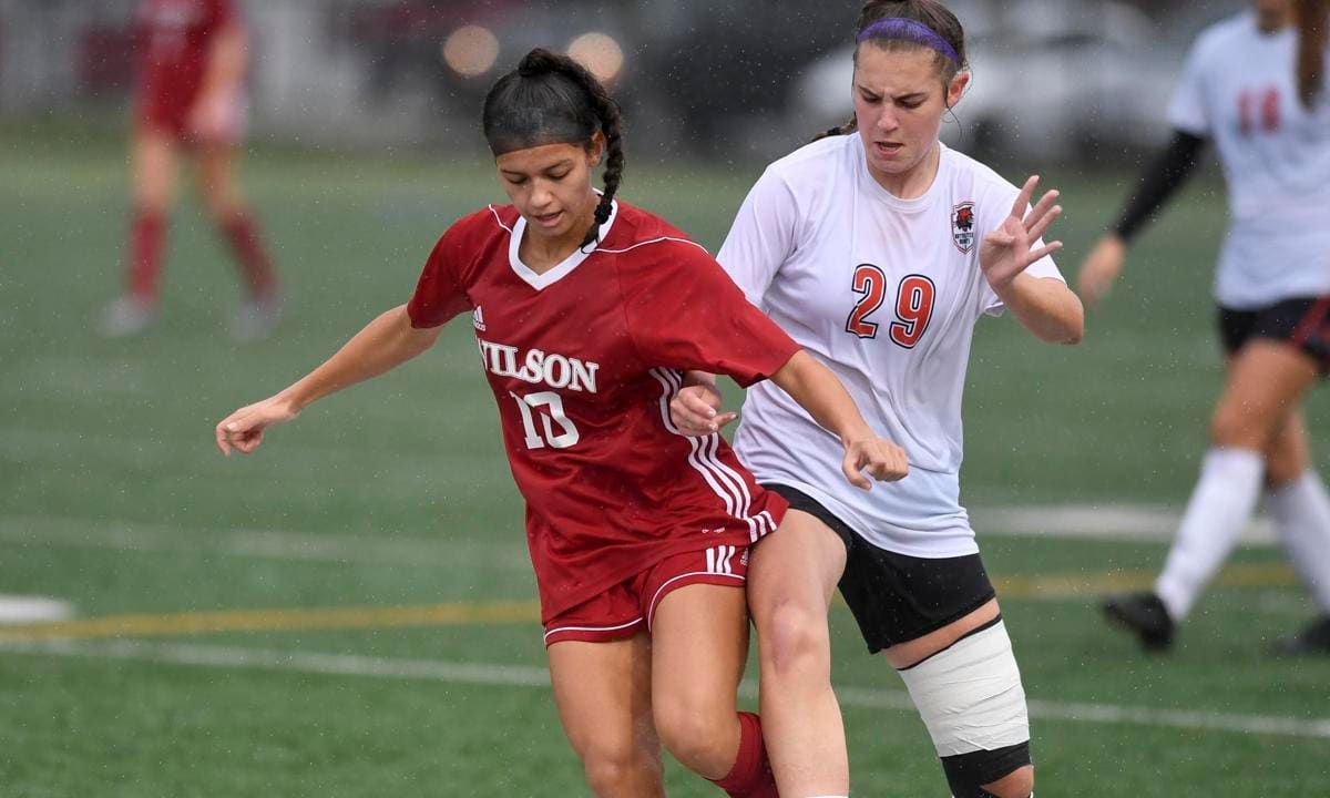 Wilson's Jailene DeJesus (10) and Northeastern's Megan Elzinga (29). Girls Soccer, Northeastern vs the Wilson Bulldogs at Bulldog Field at George Mack Stadium in West Lawn Tuesday night October 22, 2019. Photo by Ben Hasty