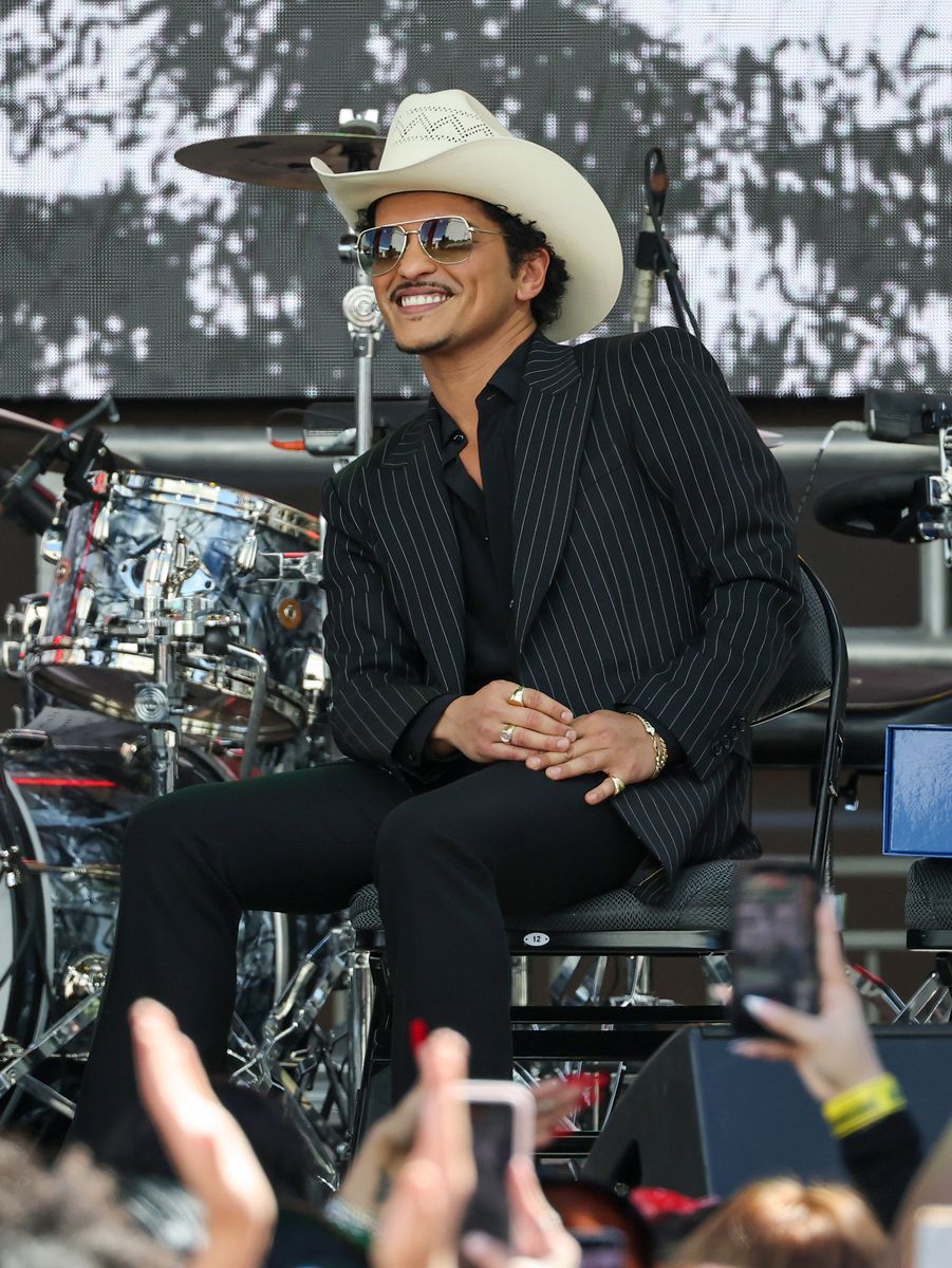 Bruno Mars reacts onstage after a parade honoring his impact on Las Vegas entertainment.