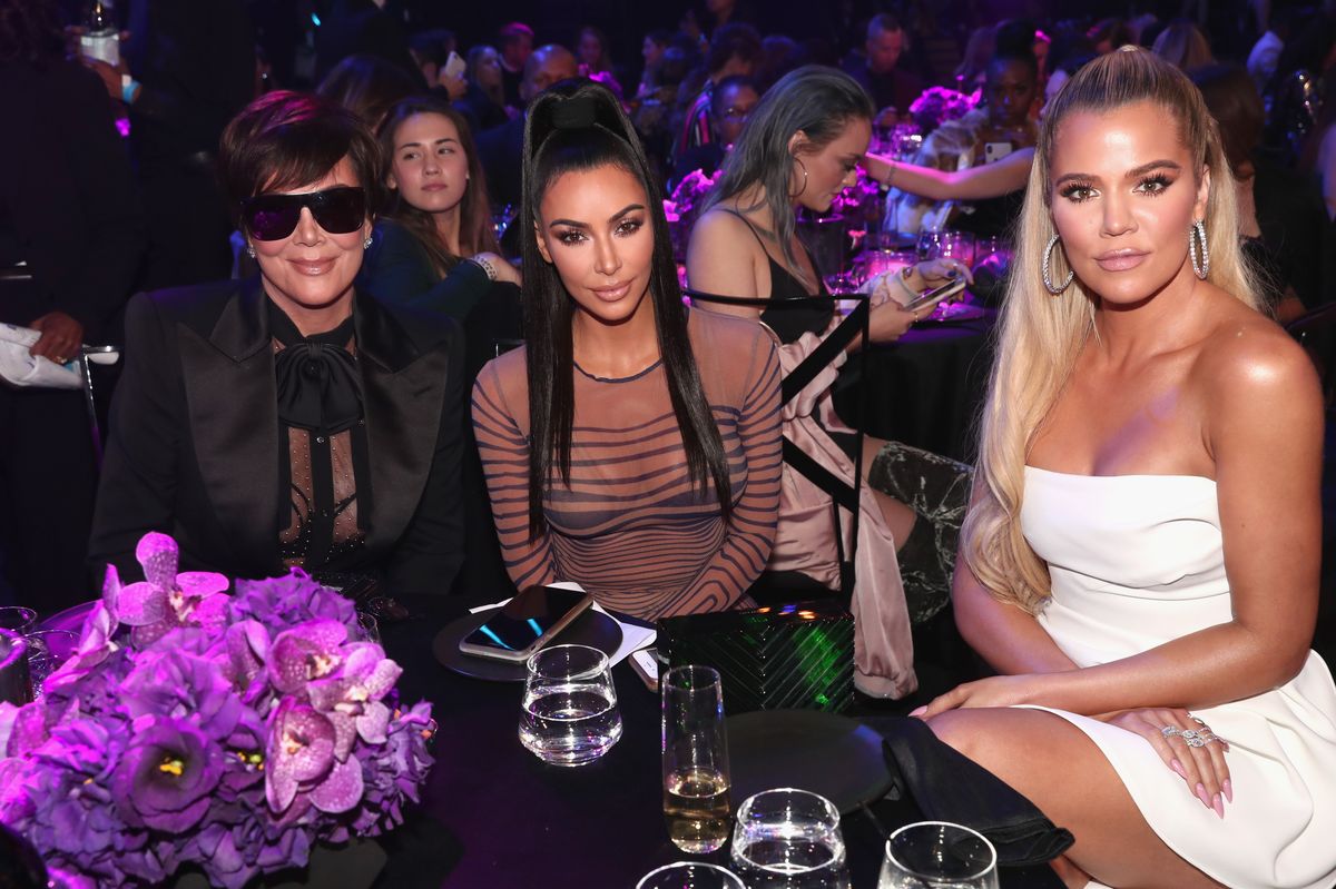  Kris Jenner, Kim Kardashian West, and Khloe Kardashian pose during the 2018 E! People's Choice Awards held at the Barker Hangar on November 11, 2018.